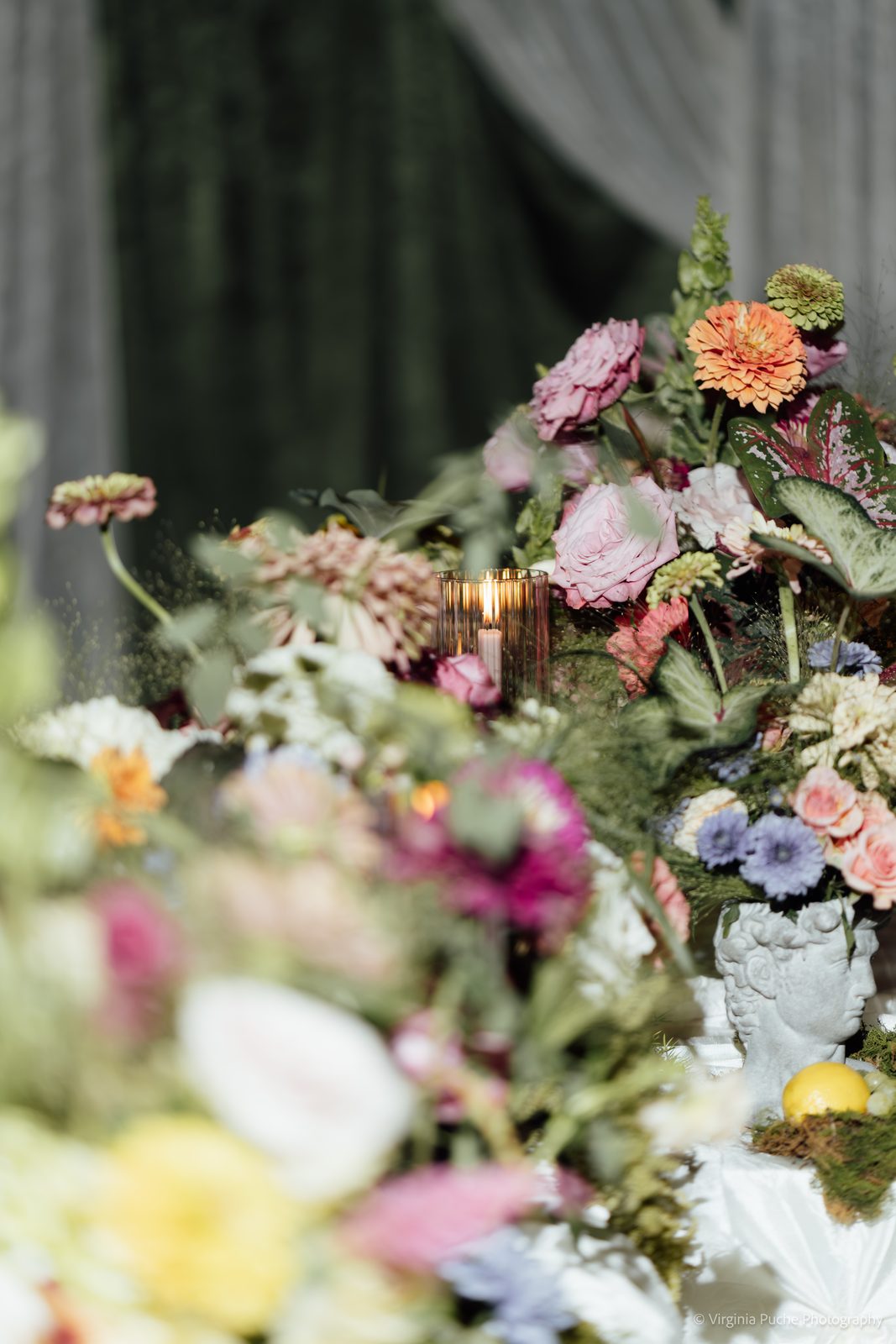 Ceremony florals and candles at a Pink Palace Mansion Memphis wedding